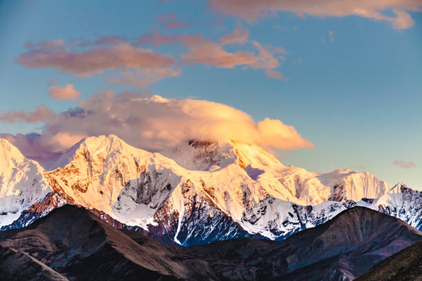 Mountain peak in sunset with moonrise for the backgrounds