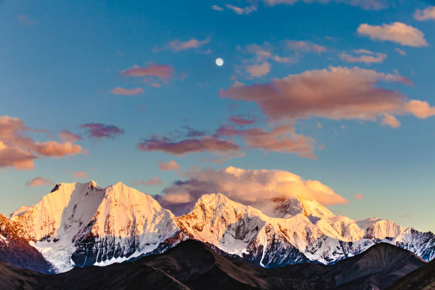 istock Mountain peak in sunset with moonrise for the backgrounds 1023877416