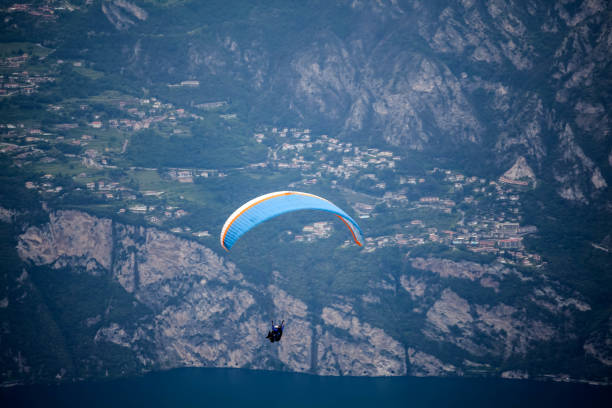 istock Paraglider over lake Garda 1023879814