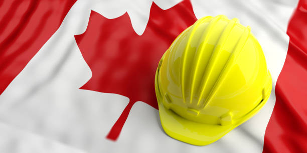 istock Yellow helmet over Canada flag. 3d illustration 1023882546