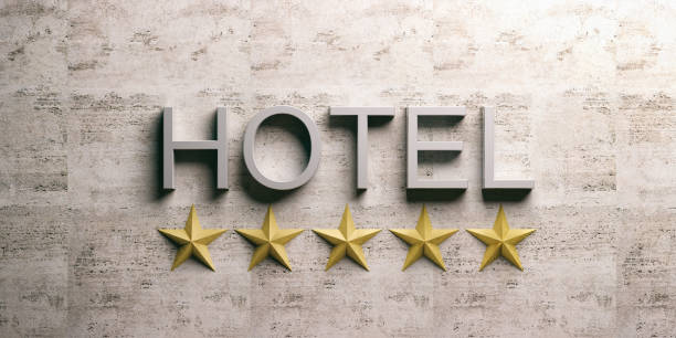 Gold signboard with hotel text and 5 stars isolated on white.Gold signboard with hotel text and 5 stars isolated on white.