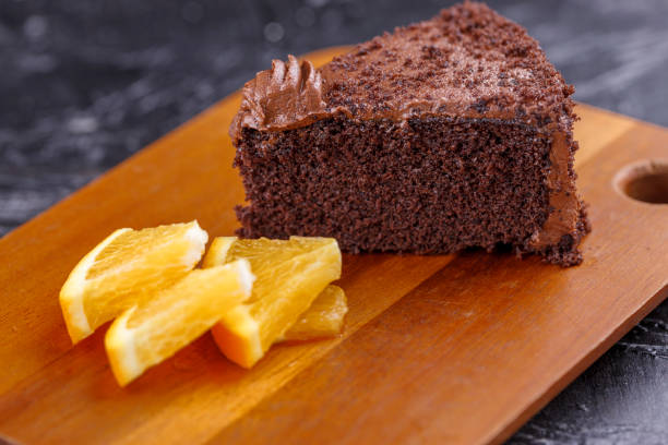 istock Slice of cake and orange slices. 1023892118