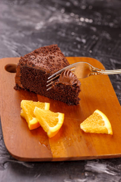 istock Cutting a piece of cake with a fork. 1023892136