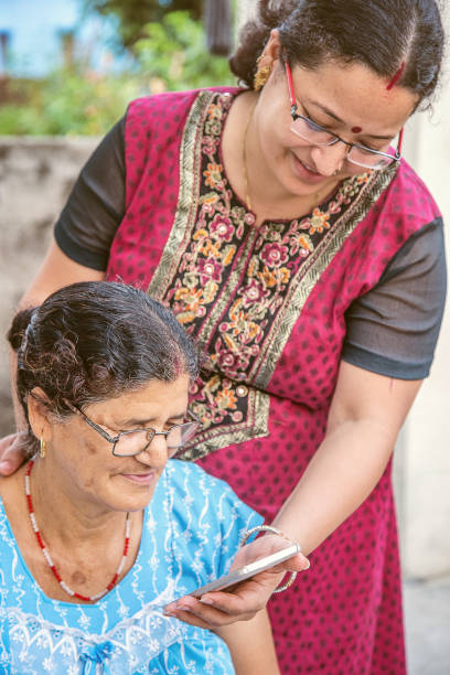 istock Daughter Showing Mother How To Use Mobile Phone 1023913280