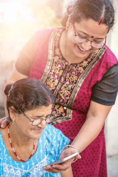 istock Daughter Showing Mother How To Use Mobile Phone 1023914080