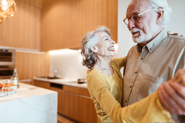 istock senior couple dancing in the kitchen 1023922228