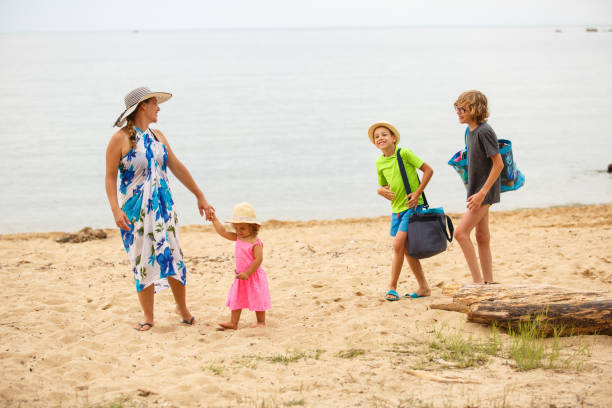istock Happy family at the beach 1023922784