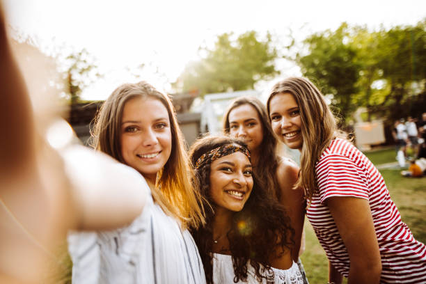 friends take a selfie in the park