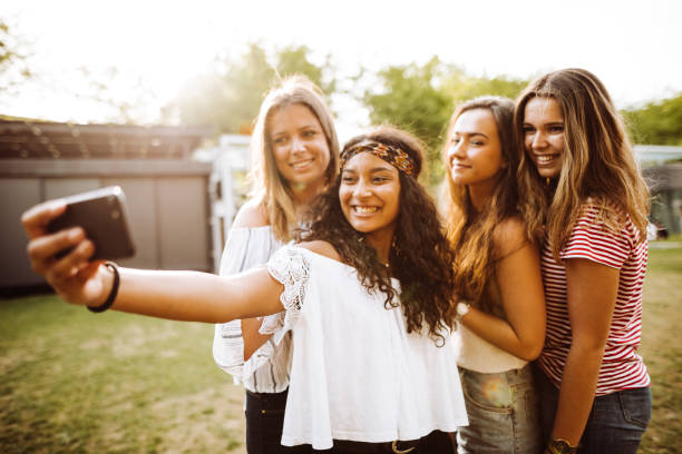 istock friends take a selfie in the park 1023923684
