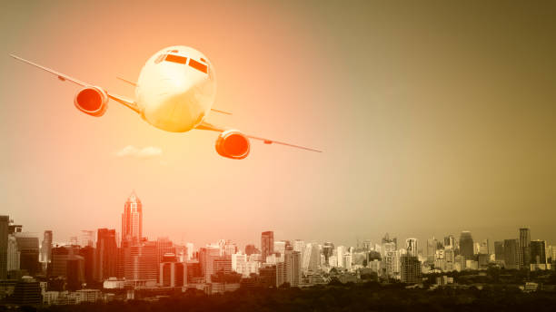 istock Aircraft fly over cityscape 1023925792