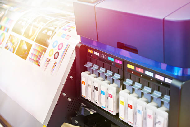 Ink cartridges and plotter stock photo