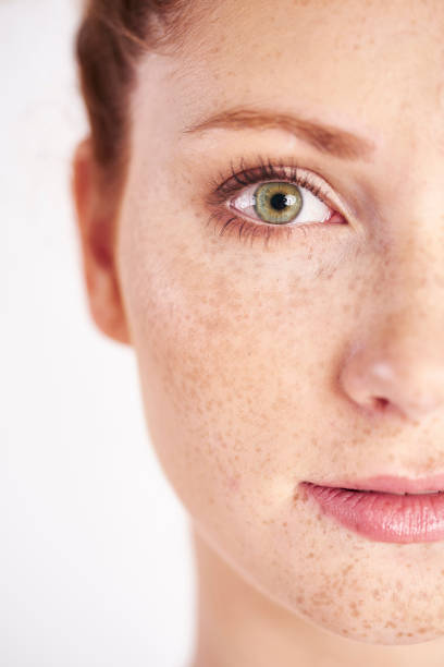 Half of woman's face Half of woman’s face green eyes photos stock pictures, royalty-free photos & images