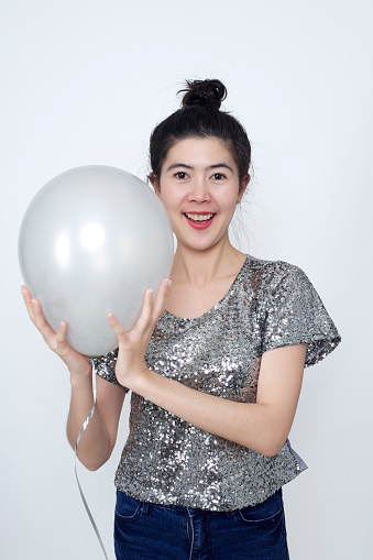 Young asians woman with balloon silver