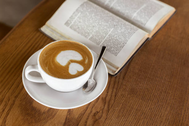 istock Coffee Cup and books on a wooden table 1023933292