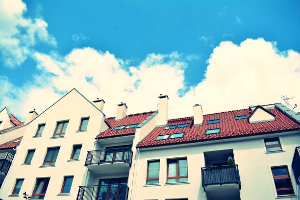 istock Modern apartment building exterior. Retro colors stylization 1023933356