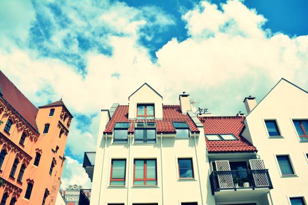 istock Modern apartment building exterior. Retro colors stylization 1023933410