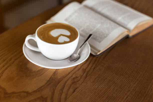 istock Coffee Cup and books on a wooden table 1023933774