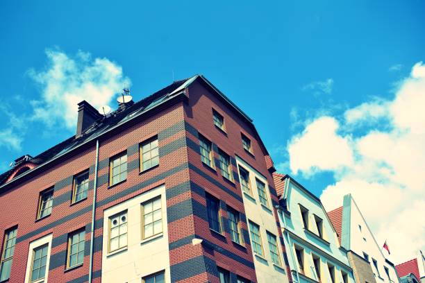 istock Modern apartment building exterior. Retro colors stylization 1023933788