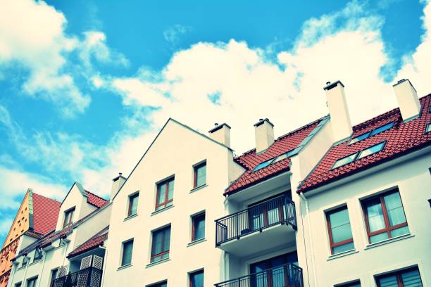 istock Modern apartment building exterior. Retro colors stylization 1023939036