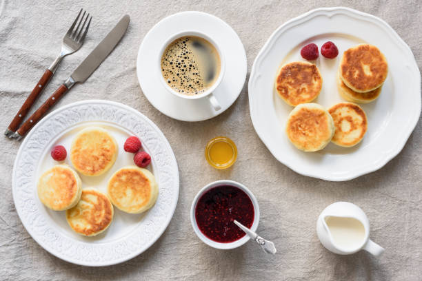 istock Breakfast Table Cottage Cheese Pancakes, Coffee, Cream, Honey and Jam 1023939510