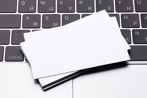 istock Blank business cards over laptop keyboard 1023953020