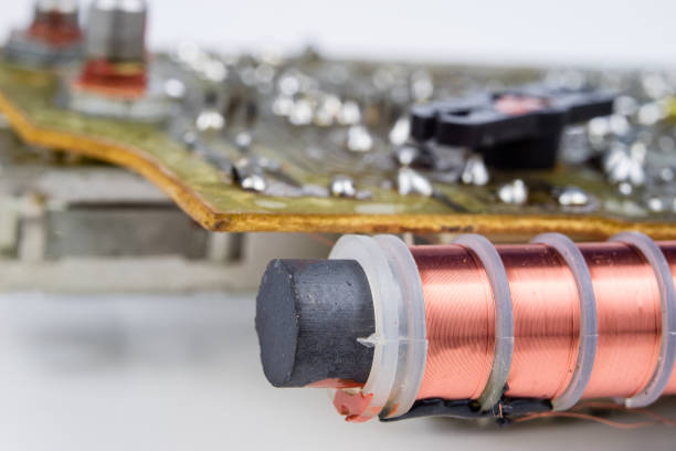 istock Old integrated circuits in an analog radio receiver. Resistors, transistors and other circuits on an old integrated circuit board. Workplace - workshop. 1023955674