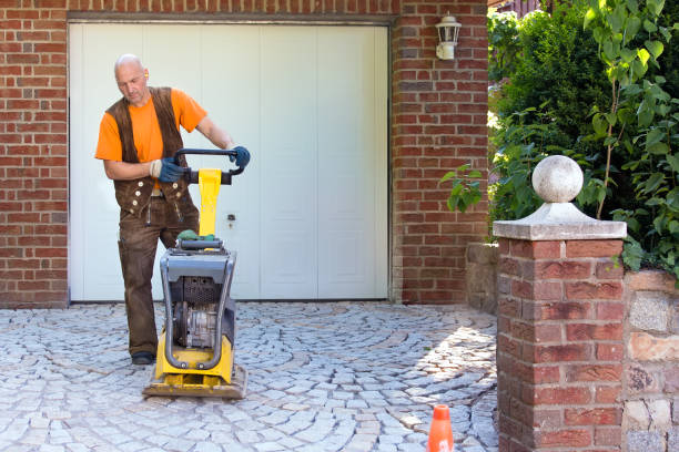 istock Installation of brick pavers on a driveway. 1023959644