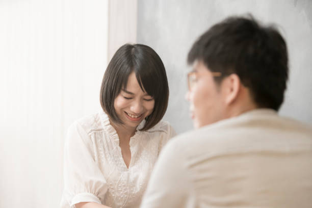 istock the girl is talking to man. 1023963220