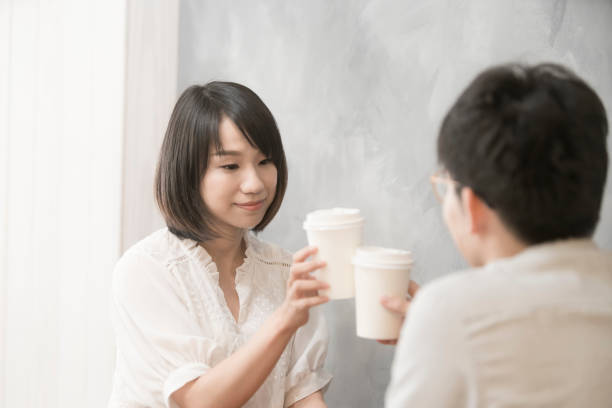 istock the girl is talking to man. 1023963346