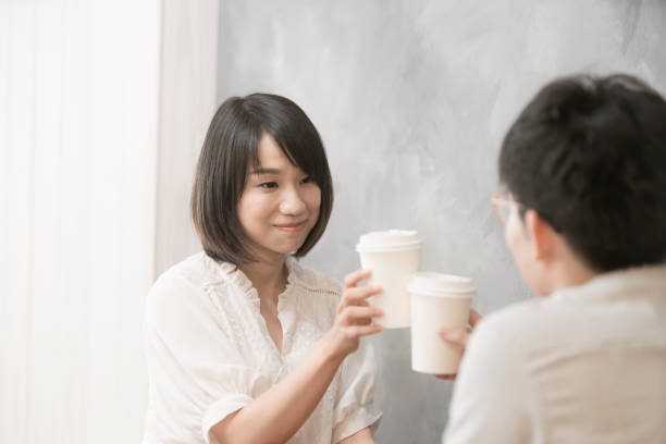 istock the girl is talking to man. 1023963360