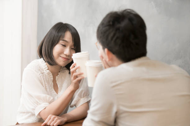 istock the girl is talking to man. 1023963552