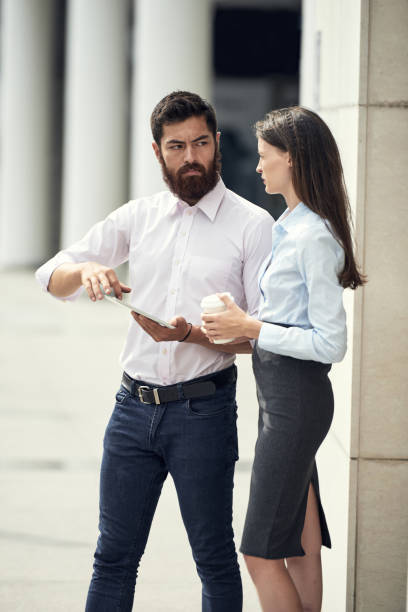 istock Talkig serious coworkers 1023966684