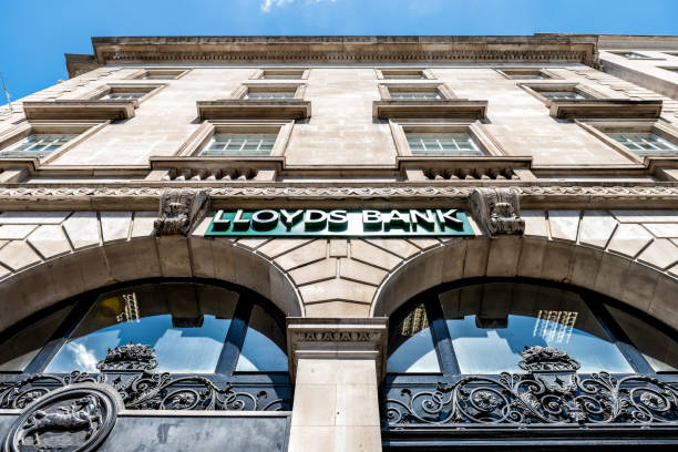 Low angle, looking up view on Lloyds Bank sign, branch, office in city London, UK - June 22, 2018: Low angle, looking up view on Lloyds Bank sign, branch, office in city lloyds of london photos stock pictures, royalty-free photos & images
