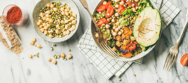 istock Vegan dinner bowl with avocado, grains, beans and fresh vegetables 1023977676