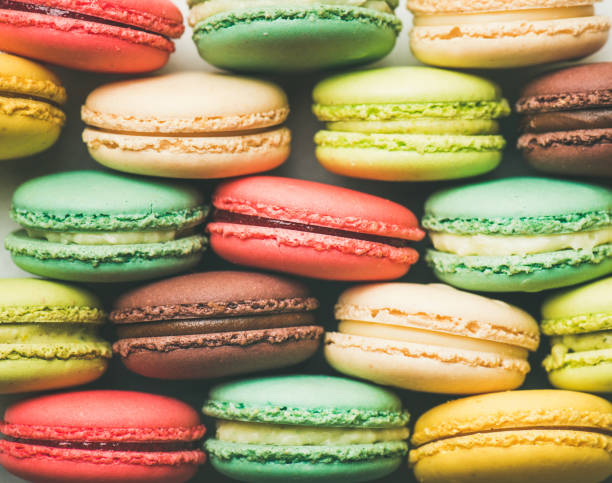 istock Colorful French macaroons cookies stacked in rows 1023980282