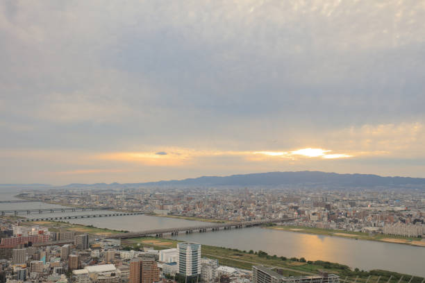 istock sunset sky over Osaka city business downtown 1023987680