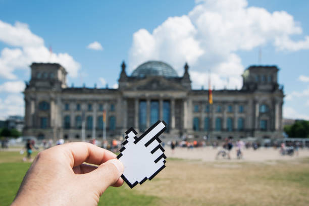 istock man pointing the Reichstag in Berlin, Germany 1023991836
