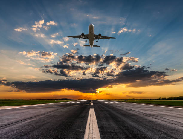 istock Passenger airplane taking off at sunset 1023993264