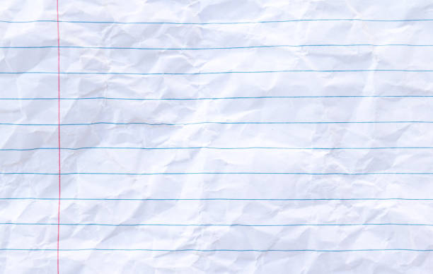 istock White lined sheet of notepad crumpled paper background 1023996580