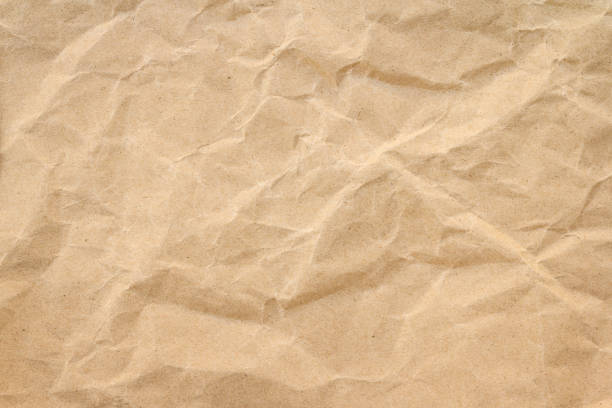 istock Brown wrinkle recycle paper background 1023996622