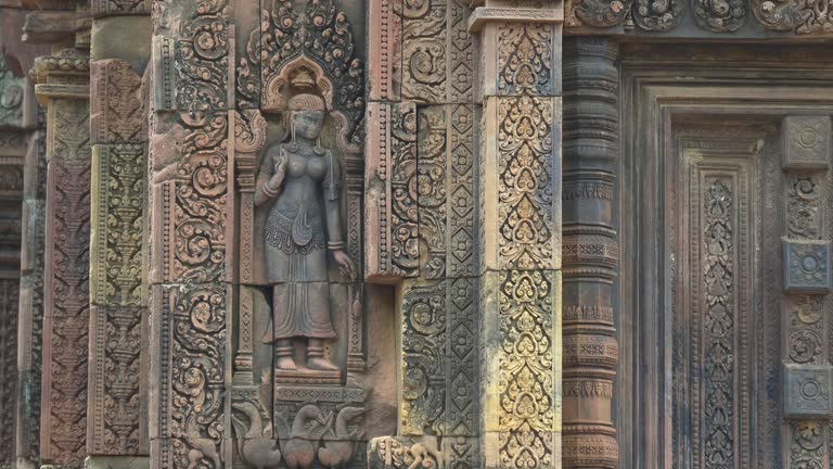 zoom in on a banteay srei devata in angkor region