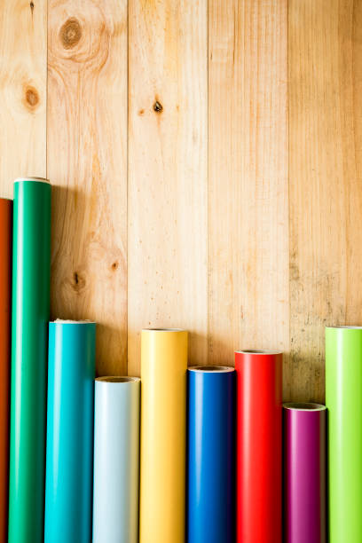 istock Colorful vinyl rolls on wooden background 1024003830