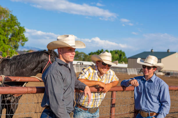 istock Cowboys Talking Together on a Horse Ranch 1024009262