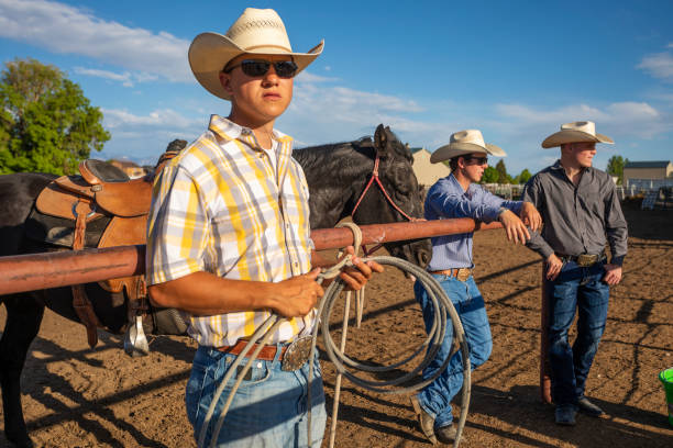 istock Cowboys Talking Together on a Horse Ranch 1024009282