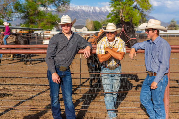 istock Cowboys Talking Together on a Horse Ranch 1024009286