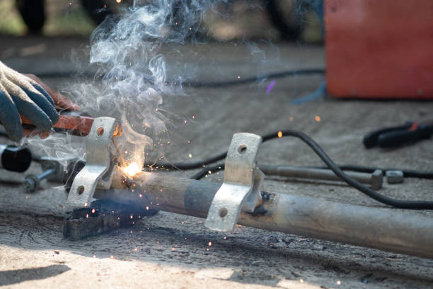 istock close up technician welding metal pole, dangerous worker. 1024014052