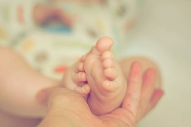 istock Little feet that made her life complete 1024029942