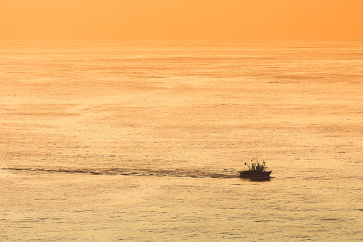 fishing ship at sunset