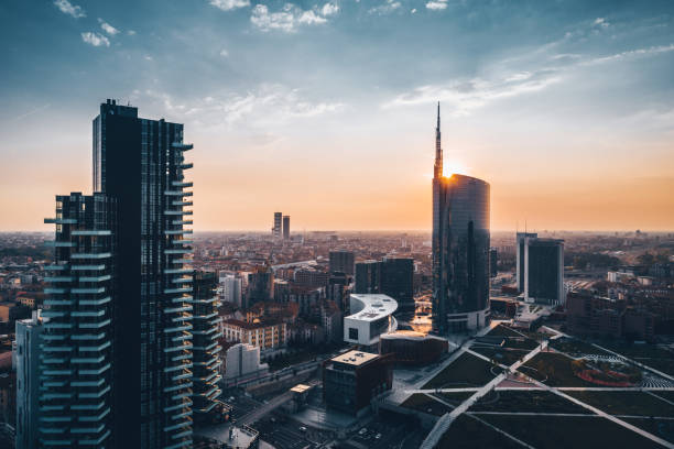 Amazing view of cityscape at sunset in a summer day Skyscraper at sunset in Milan milan photos stock pictures, royalty-free photos & images