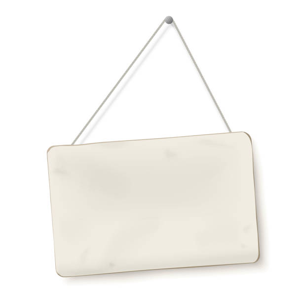 istock Old dirty piece of cardboard hanging on rope isolated on white background 1024033860